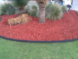 Flower-filled garden bed framed by Enviro Blocks